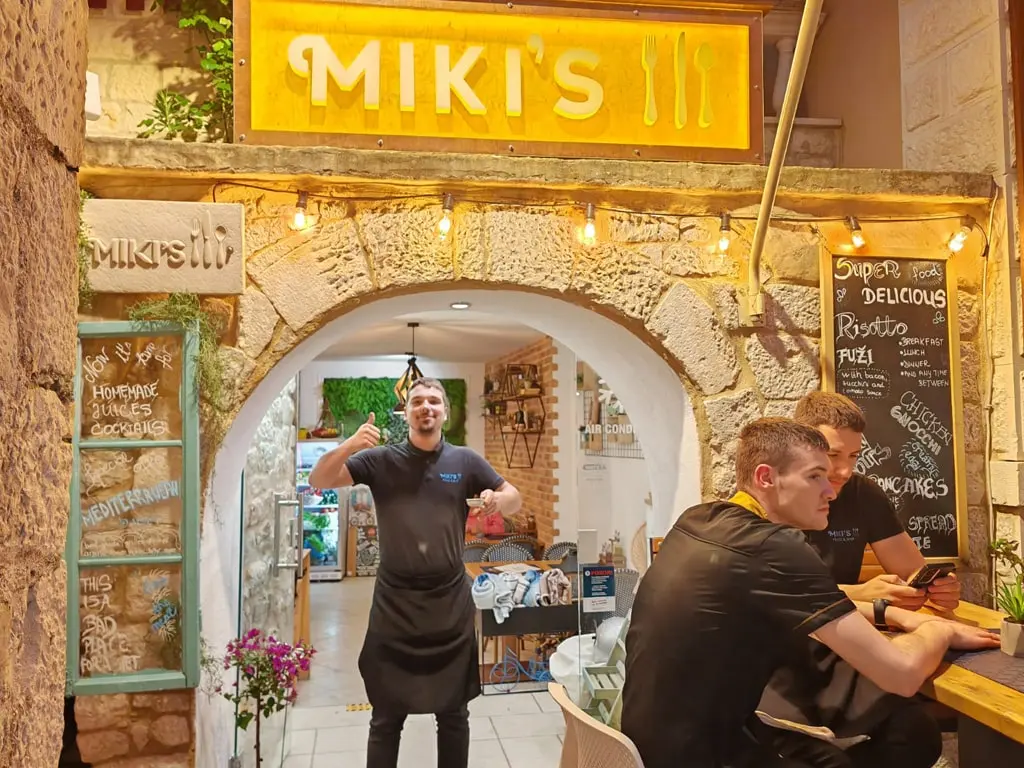 Restaurant entrance with guests at Miki's Food & Bar Trogir