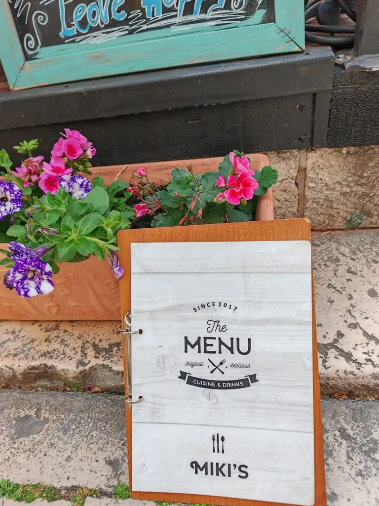 Menu and flowers detail at Miki's Food & Bar in Trogir old town