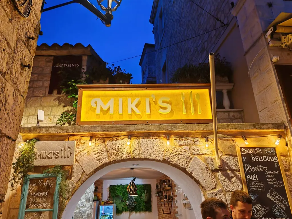 Miki's Food & Bar entrance in Trogir old town at night